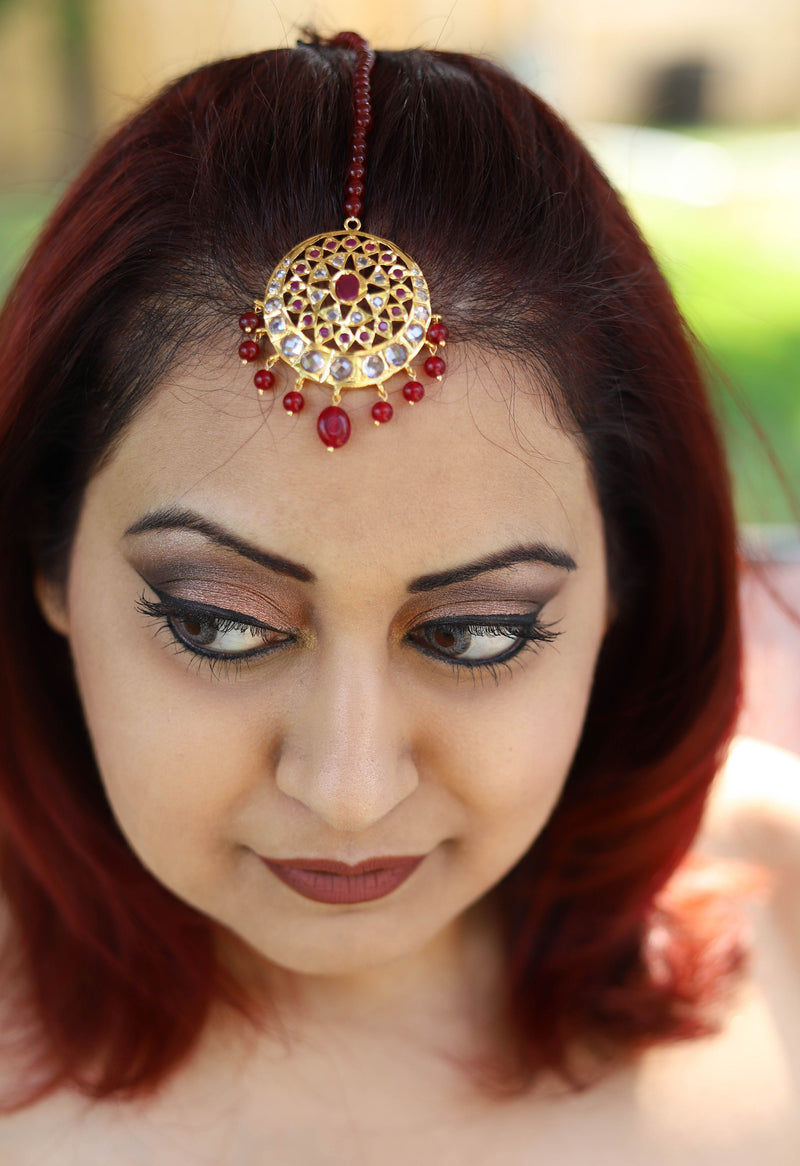 Polki tikka with ruby semi precious stones and red pearls